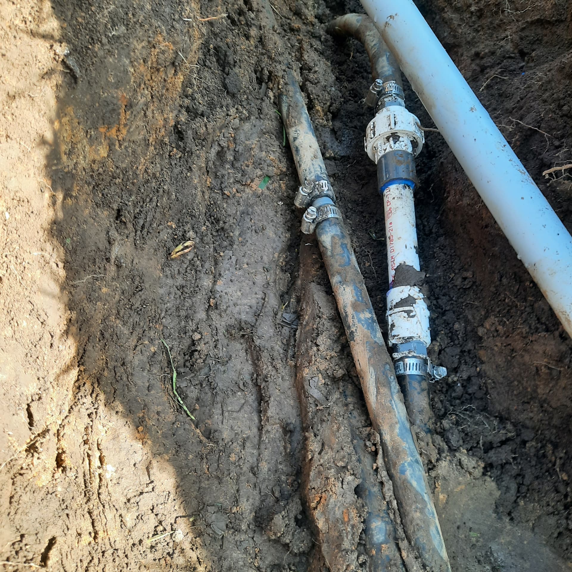 Excavated older buried water and irrigation lines during repair