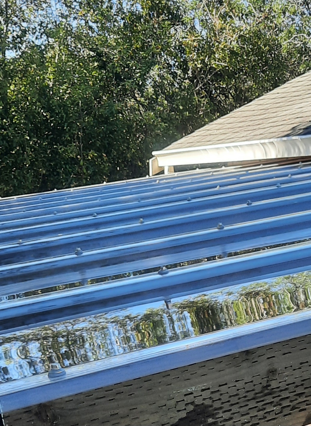 Close view of translucent corrugated overhead roofing and its fasteners at a recent McKinleyville outdoor-cover project