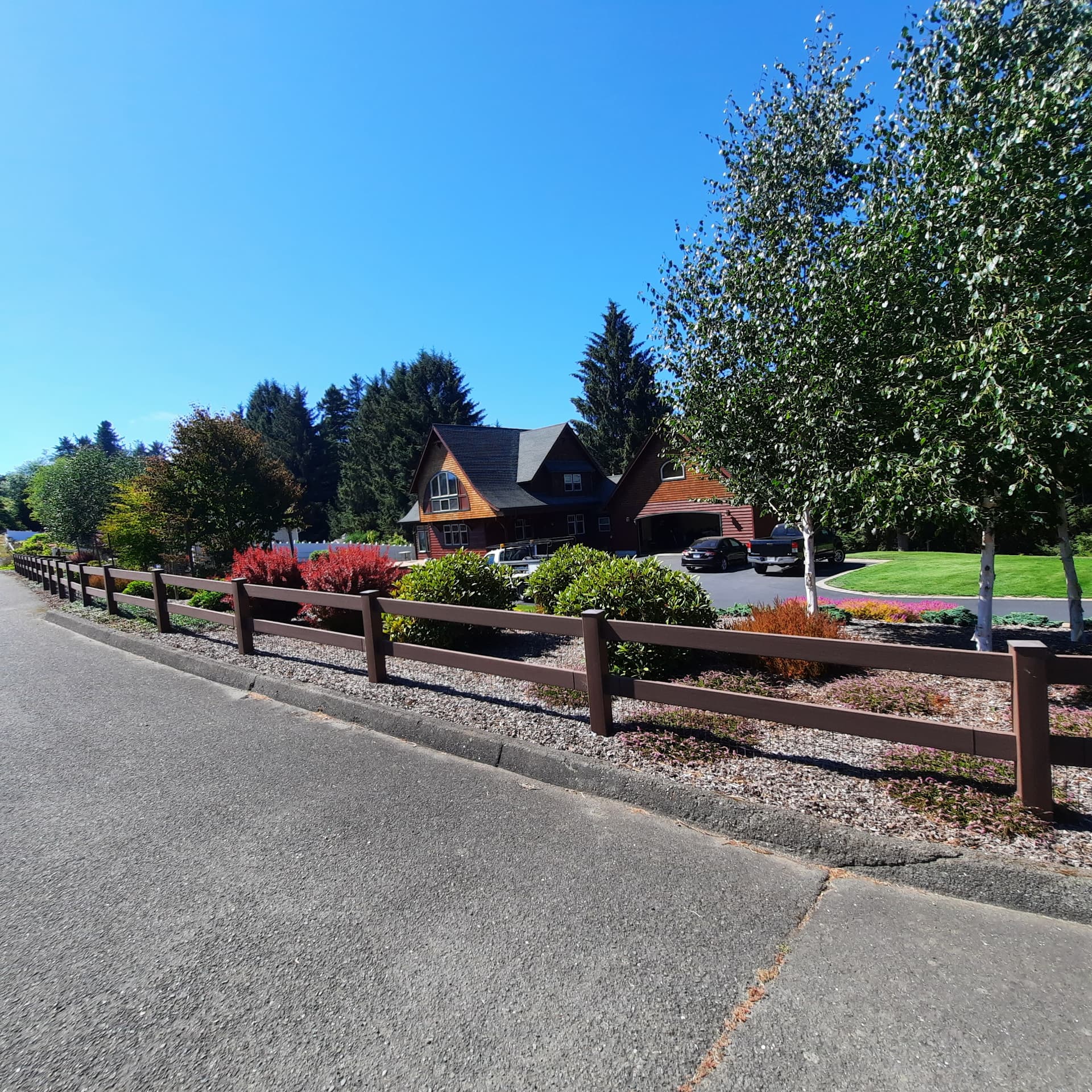 Established Norton planting beds with mulch holding grade along a shaped slope